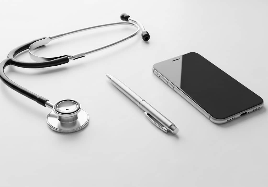 stethoscope, pen, and smartphone