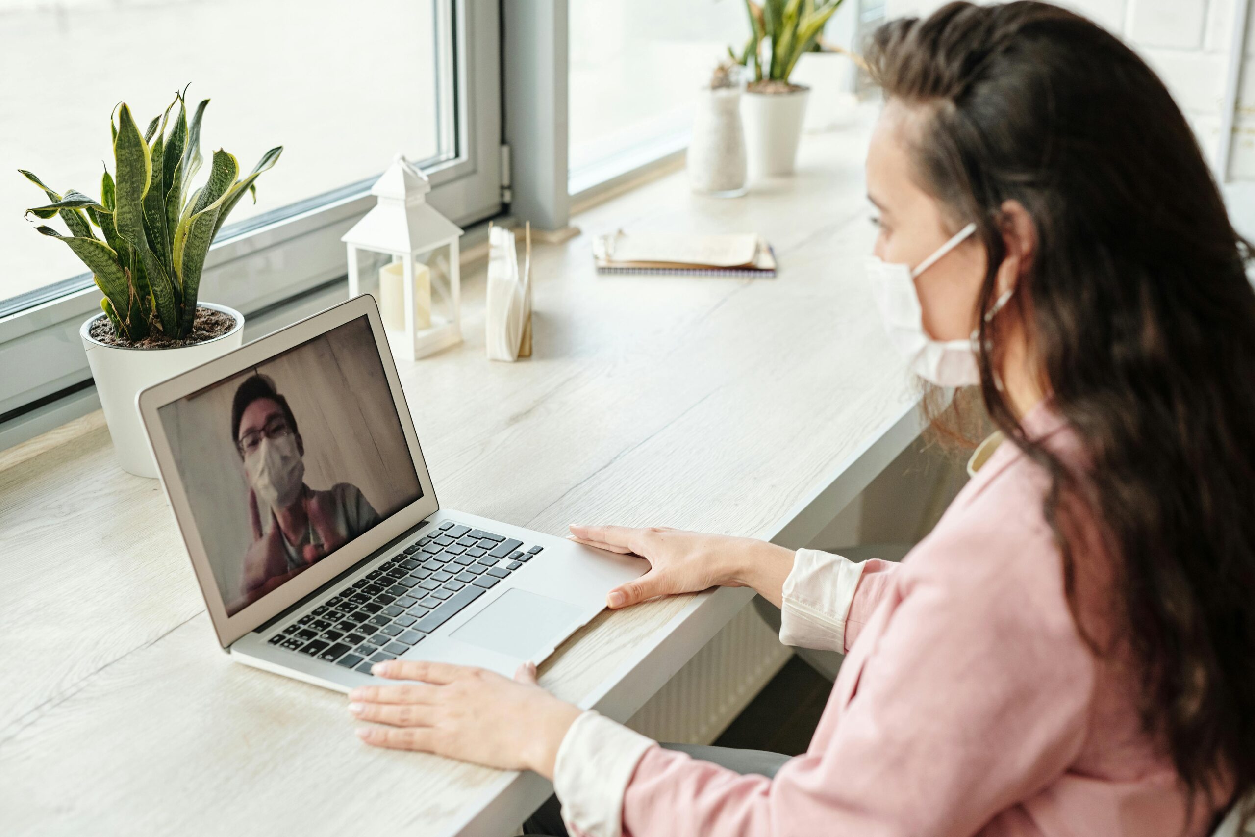 Patient having a Virtual Direct Primary Care consultation with a doctor over secure video call, highlighting personalized healthcare at home.