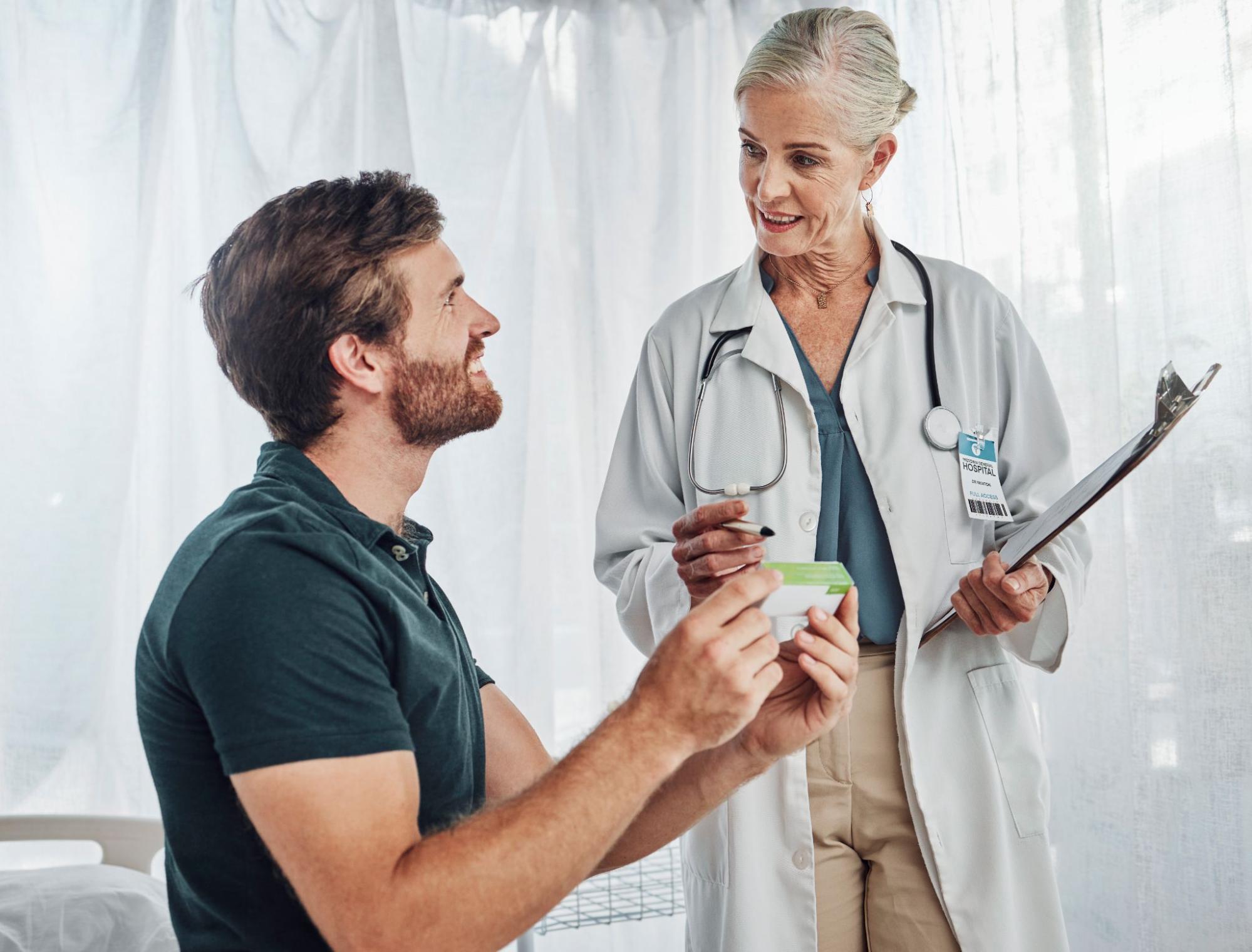 doctor talking with patient during a consultation, representing the personal connection offered by Direct Primary Care providers